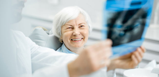 Woman being shown dental x-ray